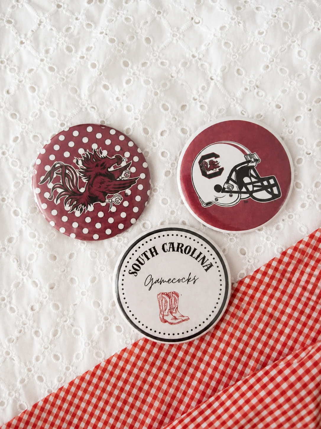 South Carolina inspired button accessories styled on a neutral flat lay